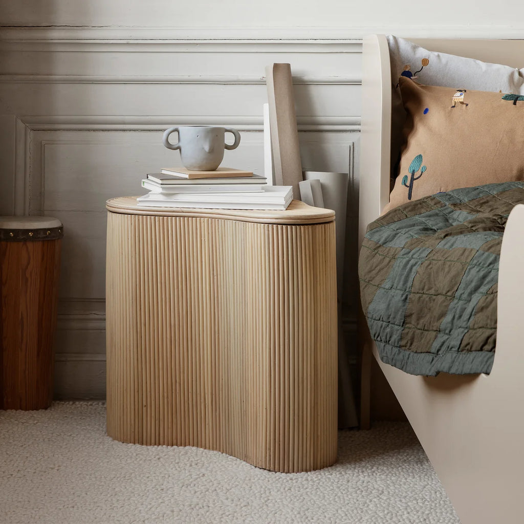 Ferm Living Isola Storage Table beside bed