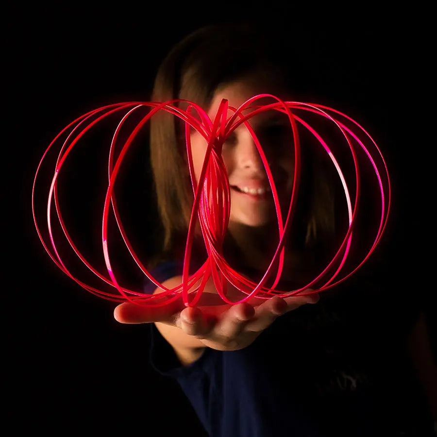 Glozi Magenta glow flow ring held in hand