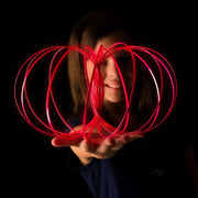 Glozi Magenta glow flow ring held in hand