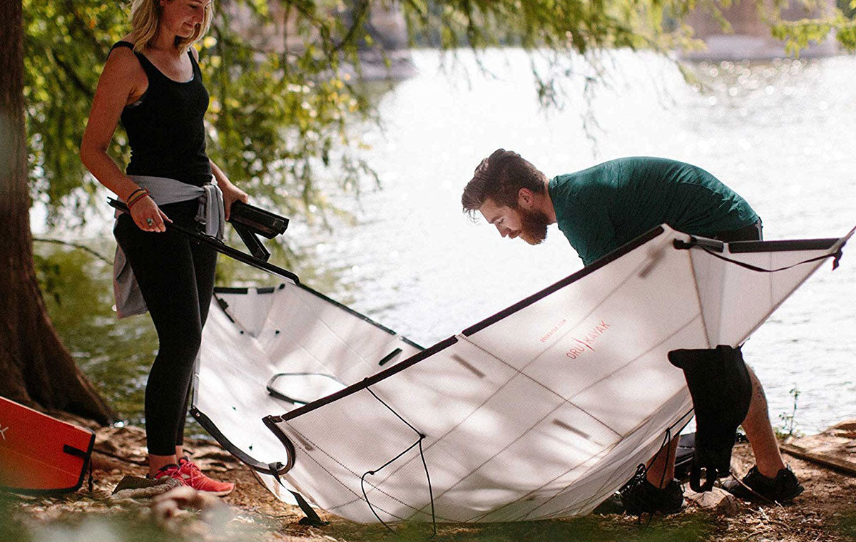Oru folding kayak being assembled by the water
