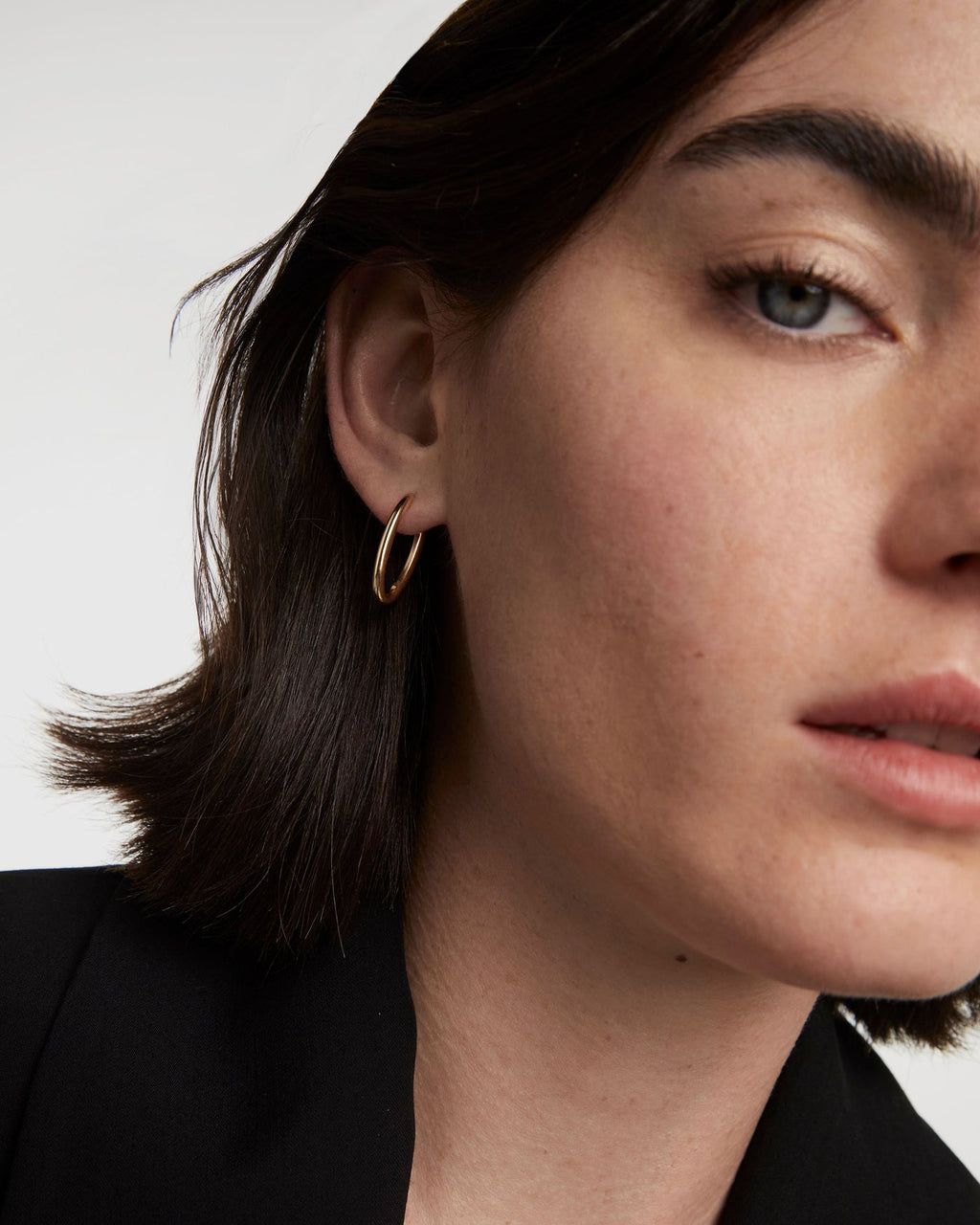 PDPAOLA Vera Hoops solid 18K gold worn on model