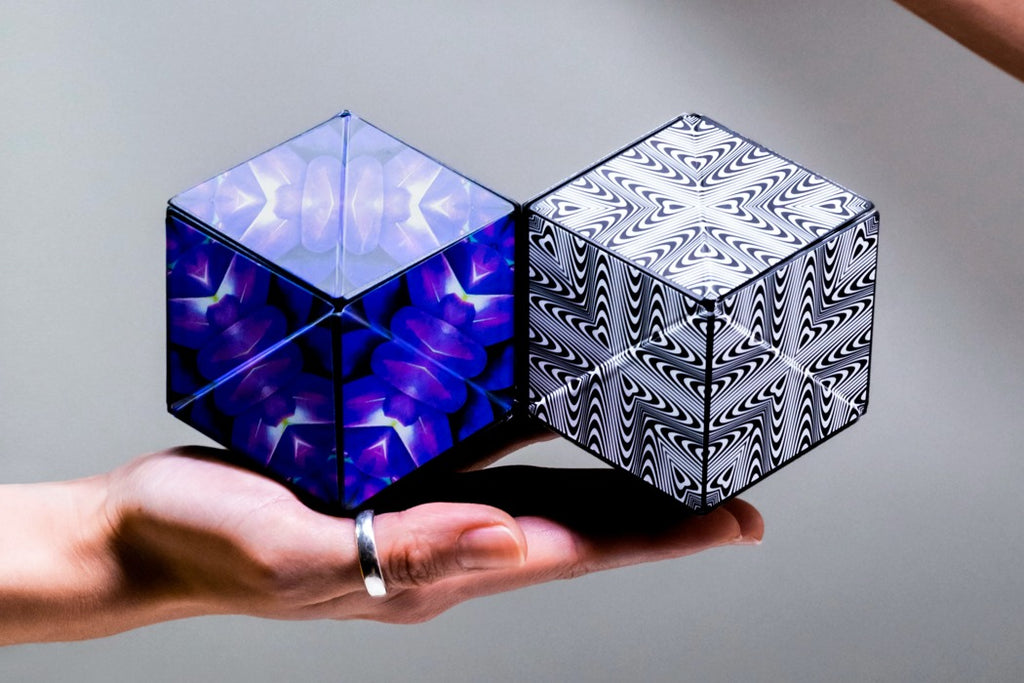 SHASHIBO magnetic puzzle cubes held in hand