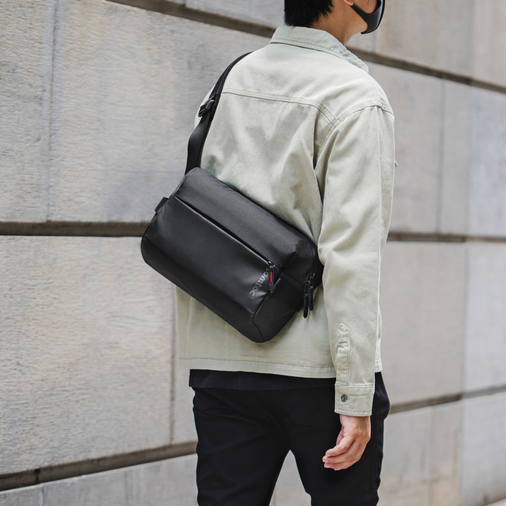 tomtoc Explorer-T21 sling bag worn in urban setting